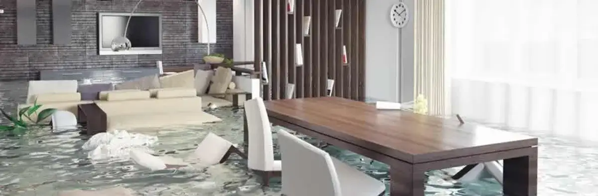 home interior affected by water damage with flooded floors and displaced furniture in Staten Island, NY